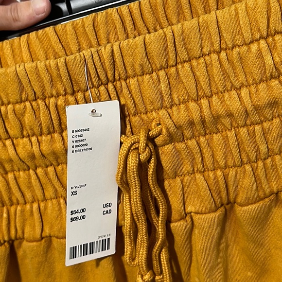 Mustard Urban Outfitters Puffy Pants with light bleach spots. - Picture 6 of 9